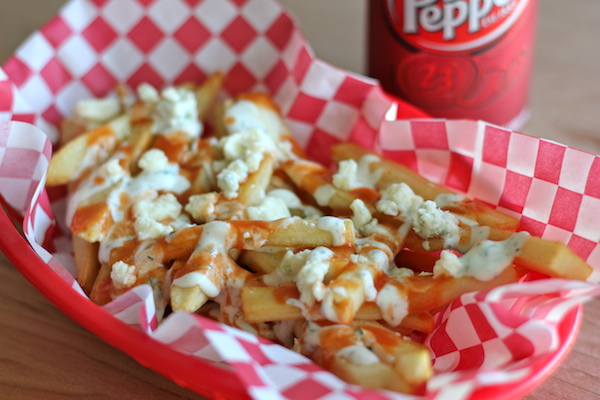 Buffalo Ranch Fries - Homemade french fries made to crisp perfection, topped with homemade Ranch dressing and buffalo sauce!