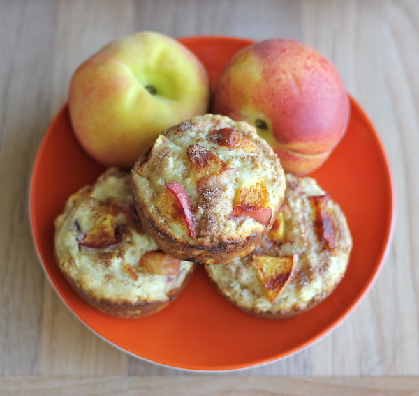 Peach Oatmeal Muffins - Wonderfully light and healthy, these cinnamon sugar crusted muffins are the perfect start to your mornings!