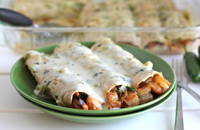 Roasted Shrimp Enchiladas with JalapeƱo Cream Sauce - Smothered in a rich, jalapeƱo cream sauce, how can you resist?!