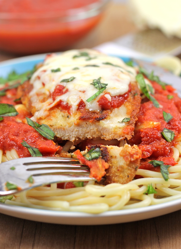 Baked Chicken Parmesan - A lighter version of the traditional chicken parmesan that's baked to absolute crisp perfection!