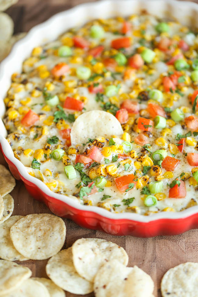 Hot Cheesy Corn Dip - A super easy and amazingly creamy corn dip that comes together with just 10 min prep. And it's even made "skinny" with Greek yogurt!