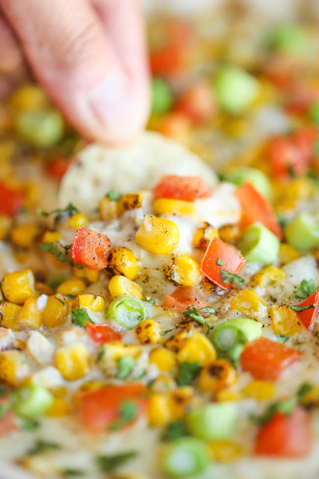 Hot Cheesy Corn Dip - A super easy and amazingly creamy corn dip that comes together with just 10 min prep. And it's even made "skinny" with Greek yogurt!