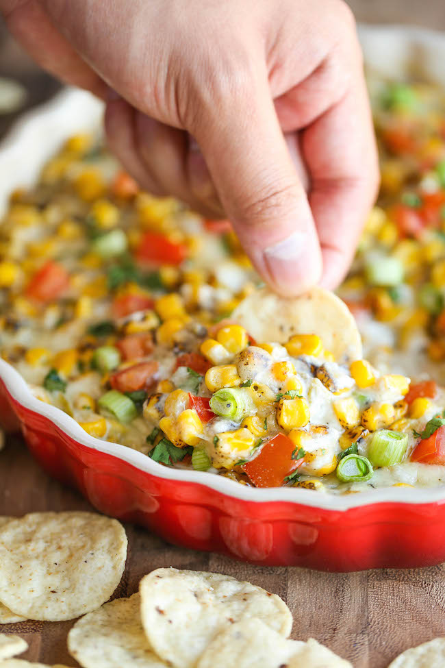 Hot Cheesy Corn Dip - A super easy and amazingly creamy corn dip that comes together with just 10 min prep. And it's even made "skinny" with Greek yogurt!