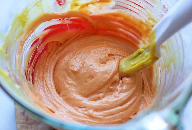 Candy Corn Cupcakes - These simple vanilla cupcakes can easily be dressed up to resemble the layers of candy corn goodness!