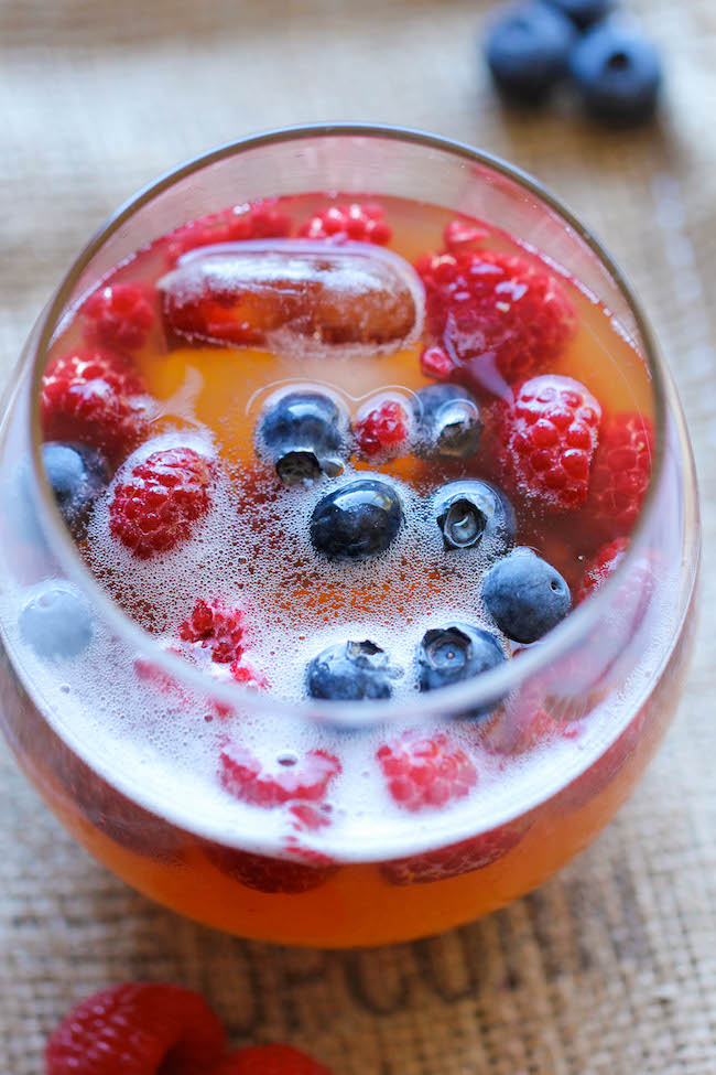 Peach Prosecco Punch - An incredibly refreshing, bubbly party punch made with Prosecco, peach nectar and fresh berries!