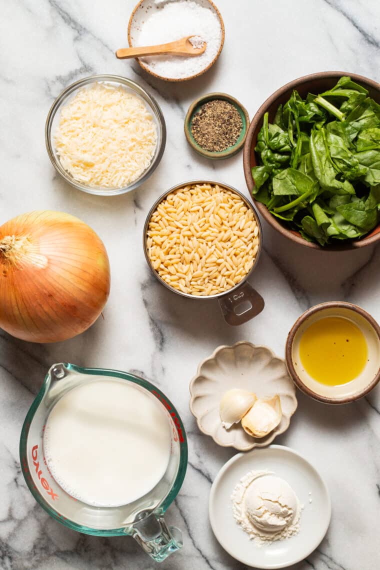 Parmesan and Spinach Orzo - This creamy, velvety orzo side dish is quick and easy + will go with any main dish! An absolute family-favorite.