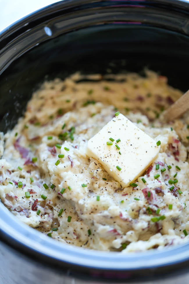 Slow Cooker Garlic Mashed Potatoes - The easiest mashed potatoes you will ever make. Just throw it all in the crockpot and you're set. Easy peasy!