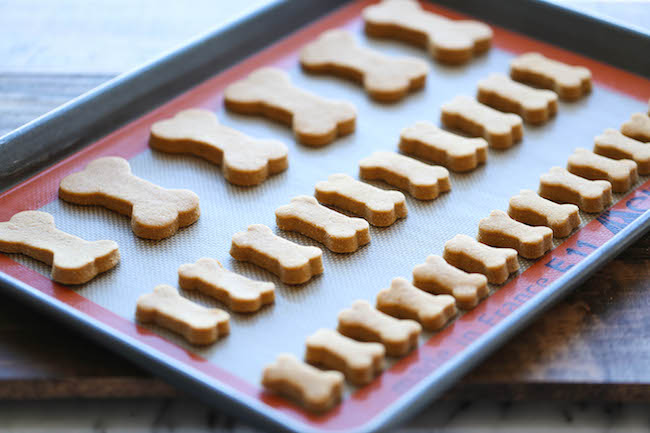 Homemade Peanut Butter Dog Treats - The easiest homemade dog treats ever - simply mix, roll and cut. Easy peasy, and so much healthier than store-bought!