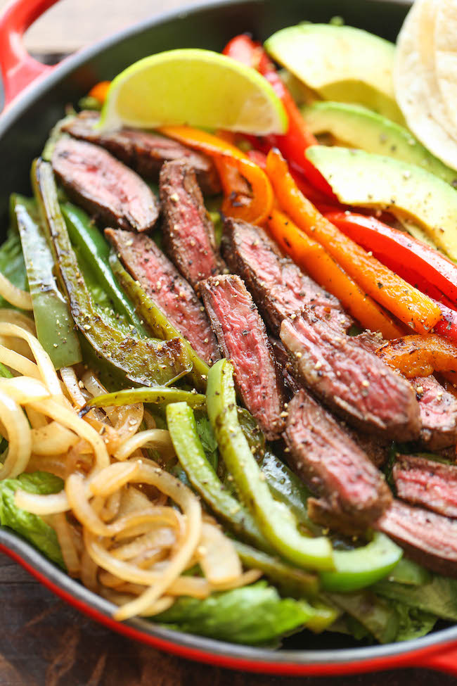 Steak Fajita Salad - All the amazing flavors of a fajita conveniently in a hearty salad, served with the creamiest cilantro lime dressing!
