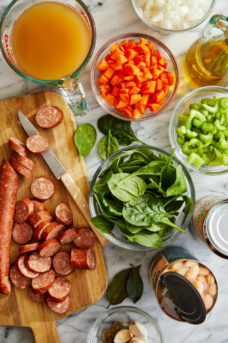 Slow Cooker Sausage, Spinach and White Bean Soup - So hearty, so comforting, and so easy to make right in the crockpot with just 10 min prep!