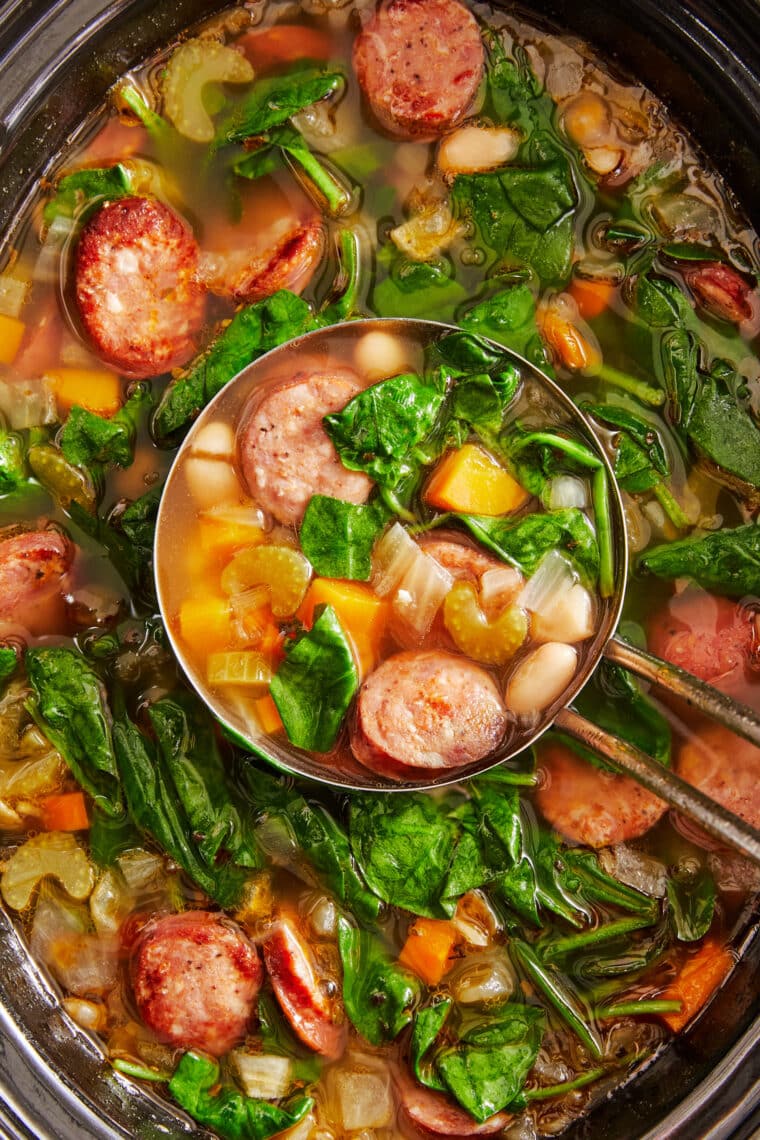 Slow Cooker Sausage, Spinach and White Bean Soup - So hearty, so comforting, and so easy to make right in the crockpot with just 10 min prep!