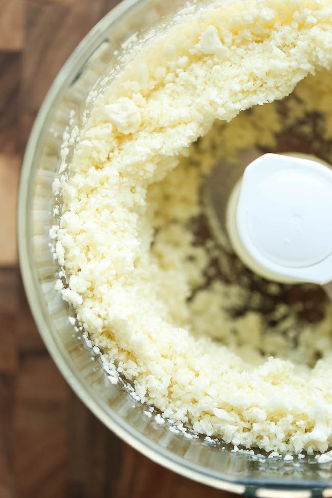 Mini Cauliflower Pizzas - These pizzas are made into easy single-serving portions and are so much healthier with a crisp cauliflower crust! 98.5 calories.