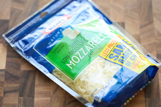 Mini Cauliflower Pizzas - These pizzas are made into easy single-serving portions and are so much healthier with a crisp cauliflower crust! 98.5 calories.