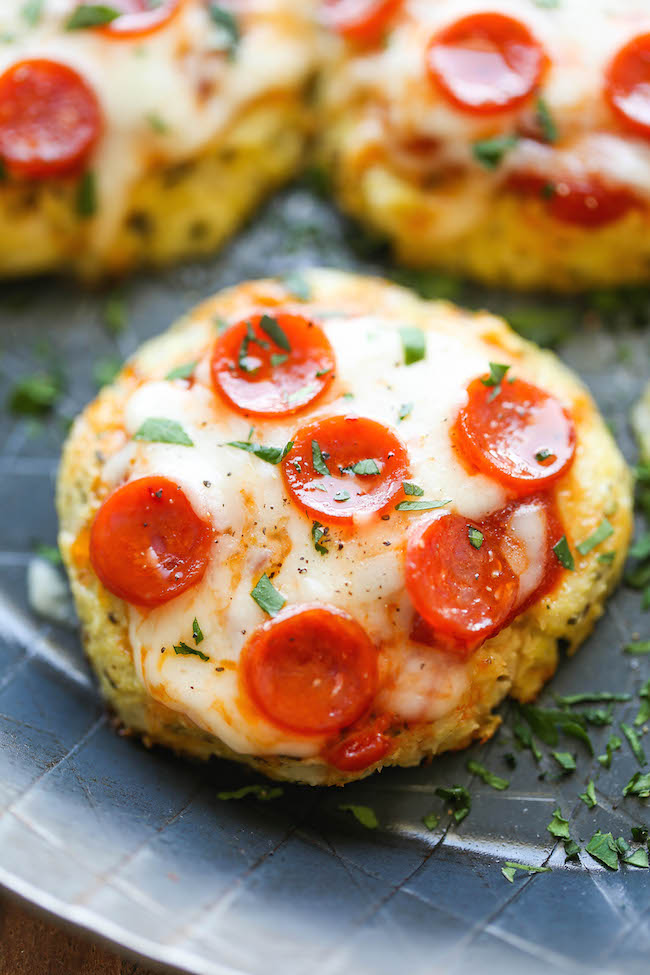 Mini Cauliflower Pizzas - These pizzas are made into easy single-serving portions and are so much healthier with a crisp cauliflower crust! 98.5 calories.