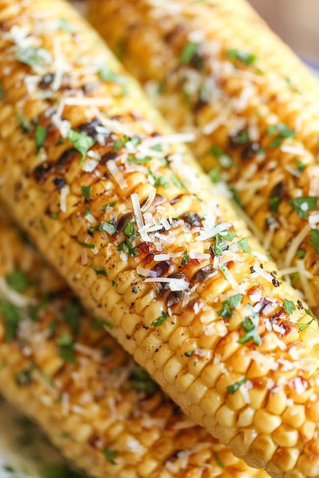 Parmesan Corn on the Cob - So buttery, garlicky and loaded with Parmesan cheese goodness - grilled (or roasted) to absolute perfection! 