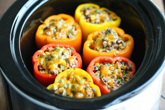 Slow Cooker Stuffed Peppers - Hearty, protein/fiber loaded peppers packed with so much flavor - and it's all made in the crockpot. Easy and effortless!