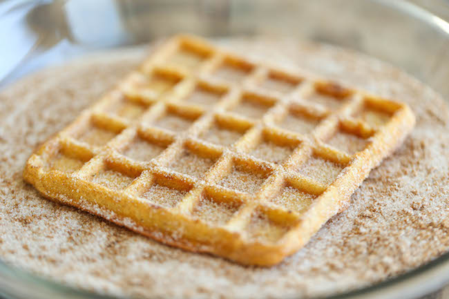 Pumpkin Churro Waffles - Light, fluffy, melt-in-your mouth pumpkin waffles coated in buttery cinnamon sugar and drizzled with a cream cheese glaze! Amazing.