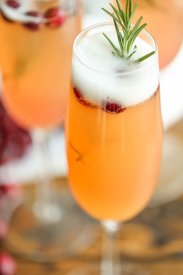 Cranberry Mimosa - The only holiday cocktail recipe you need. Just 6 ingredients (2 are garnishes) for the prettiest, easiest and elegant drink ever! Done.