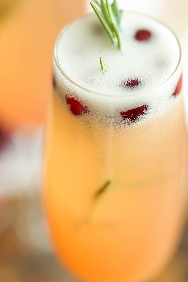 Cranberry Mimosa - The only holiday cocktail recipe you need. Just 6 ingredients (2 are garnishes) for the prettiest, easiest and elegant drink ever! Done.