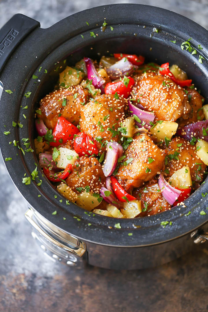 Slow Cooker Pineapple Chicken - Everyone's takeout favorite made right in the crockpot! The chicken is SO TENDER and JUICY bursting with so much flavor!