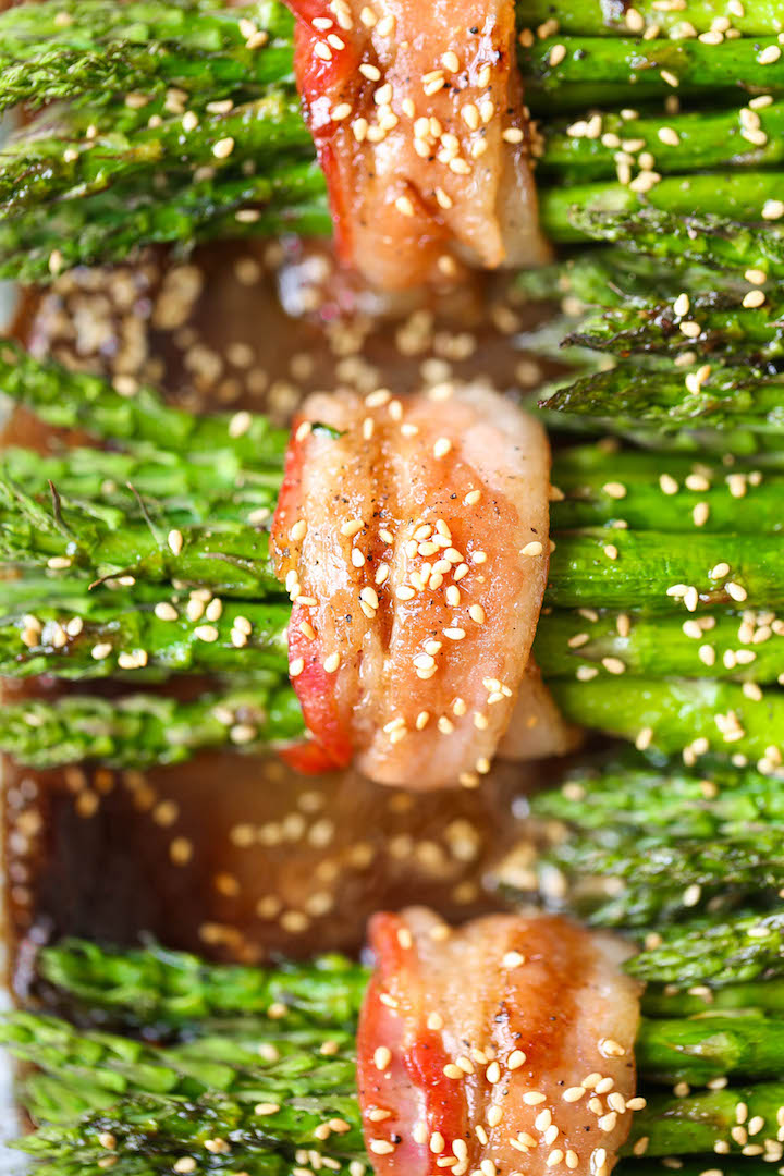 Bacon Wrapped Asparagus - Asparagus bundles wrapped in crisp-tender bacon in a buttery brown sugar glaze - grilled or baked! Can be prepped in advance!