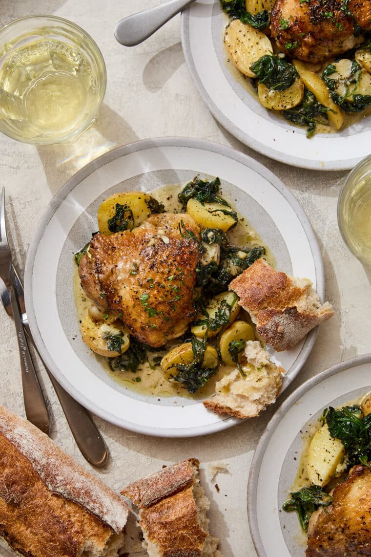 Chicken and Potatoes with Garlic Parmesan Cream Sauce - A complete meal in one! Baked crisp-tender chicken with potatoes and spinach, so good!