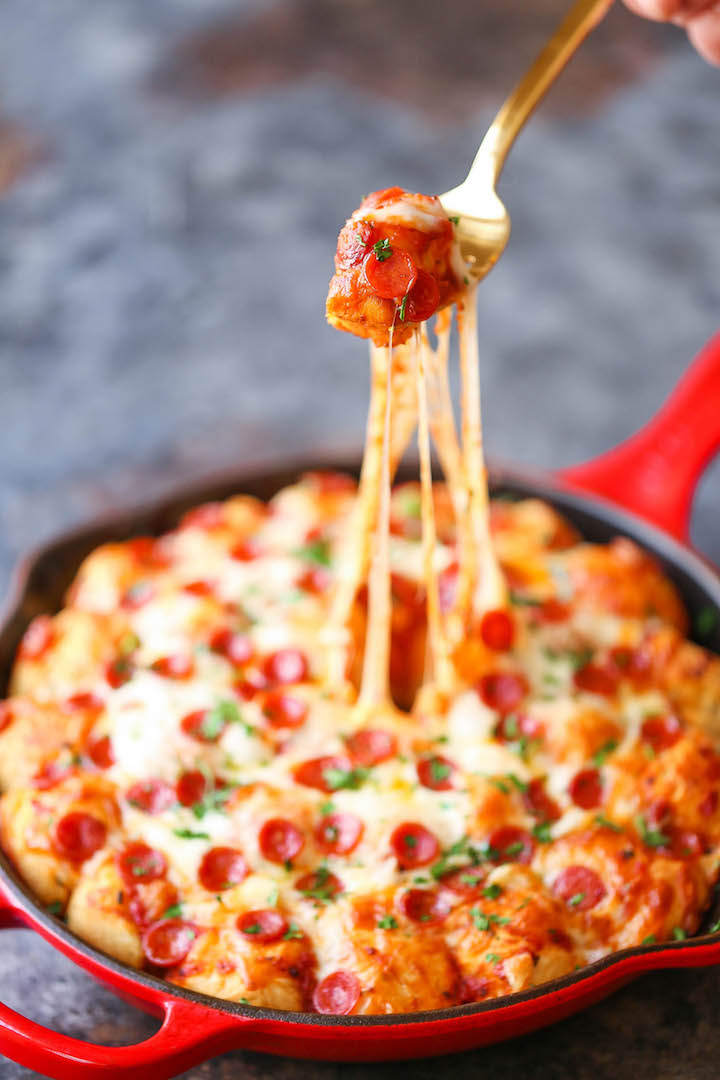Cheesy Pizza Bread - The best and cheesiest pull apart bread ever! An easy addition to any menu or occasion. Except everyone will be fighting for a piece!
