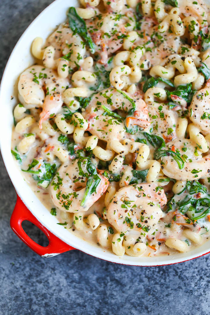 Shrimp Pasta with Tomato Basil Cream Sauce - Unbelievably CREAMY and just melt-in-your-mouth AMAZING!!! Loaded with sun dried tomatoes, spinach and basil.