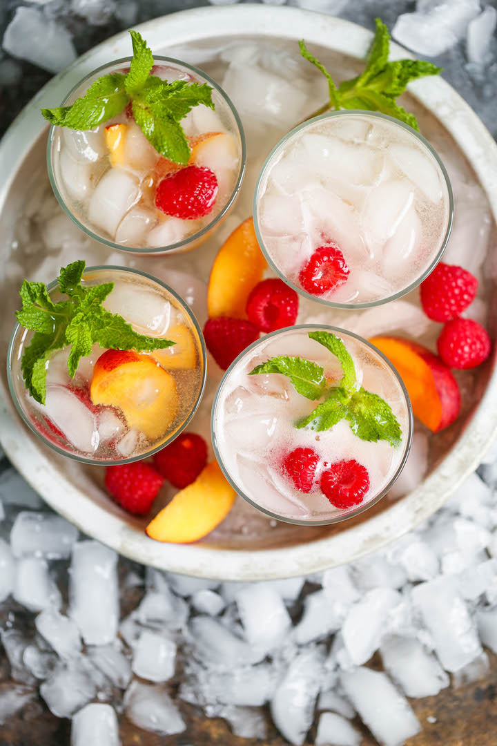 Raspberry Peach Sangria - The perfect make-ahead cocktail for any occasion! Takes literally just 5 min! Let chill and serve with sparkling wine. That's it!