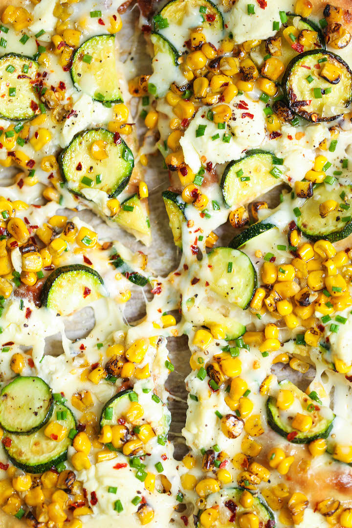 White Zucchini Corn Pizza - Use up all your lingering zucchini in the most amazing white pizza! With corn kernels, dollops of ricotta and mozzarella cheese!