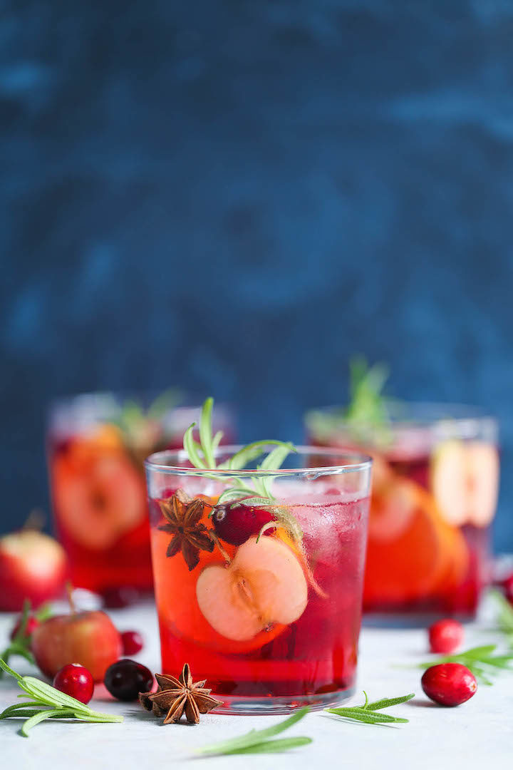Cranberry Apple Sangria - The must have spiced holiday cocktail! With cranberries, apples, oranges, cinnamon and cloves! You can make this ahead of time!