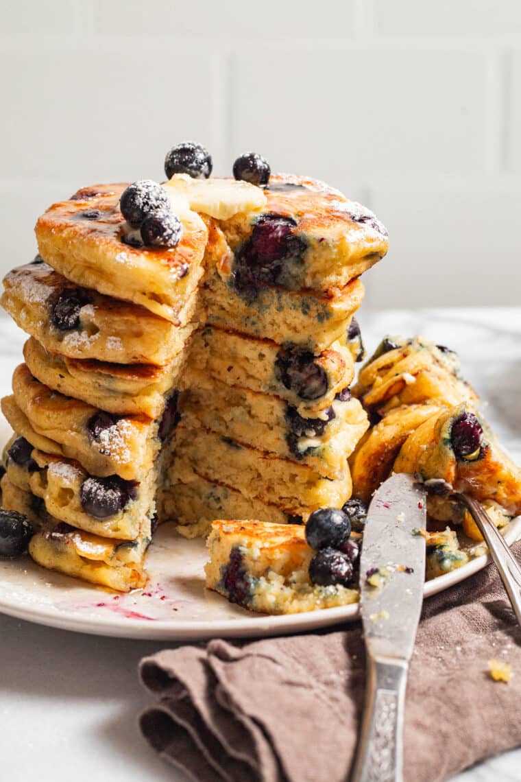 Blueberry Sour Cream Pancakes - Light, fluffy, melt-in-your-mouth buttery pancakes with juicy blueberries. Restaurant-quality right at home!