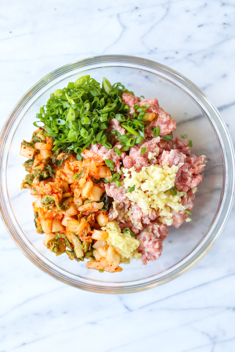 Pork and Kimchi Potstickers - Easy peasy potstickers! Perfectly crispy + a crowd-favorite with an amazing pork-kimchi filling! BONUS: it's freezer-friendly.