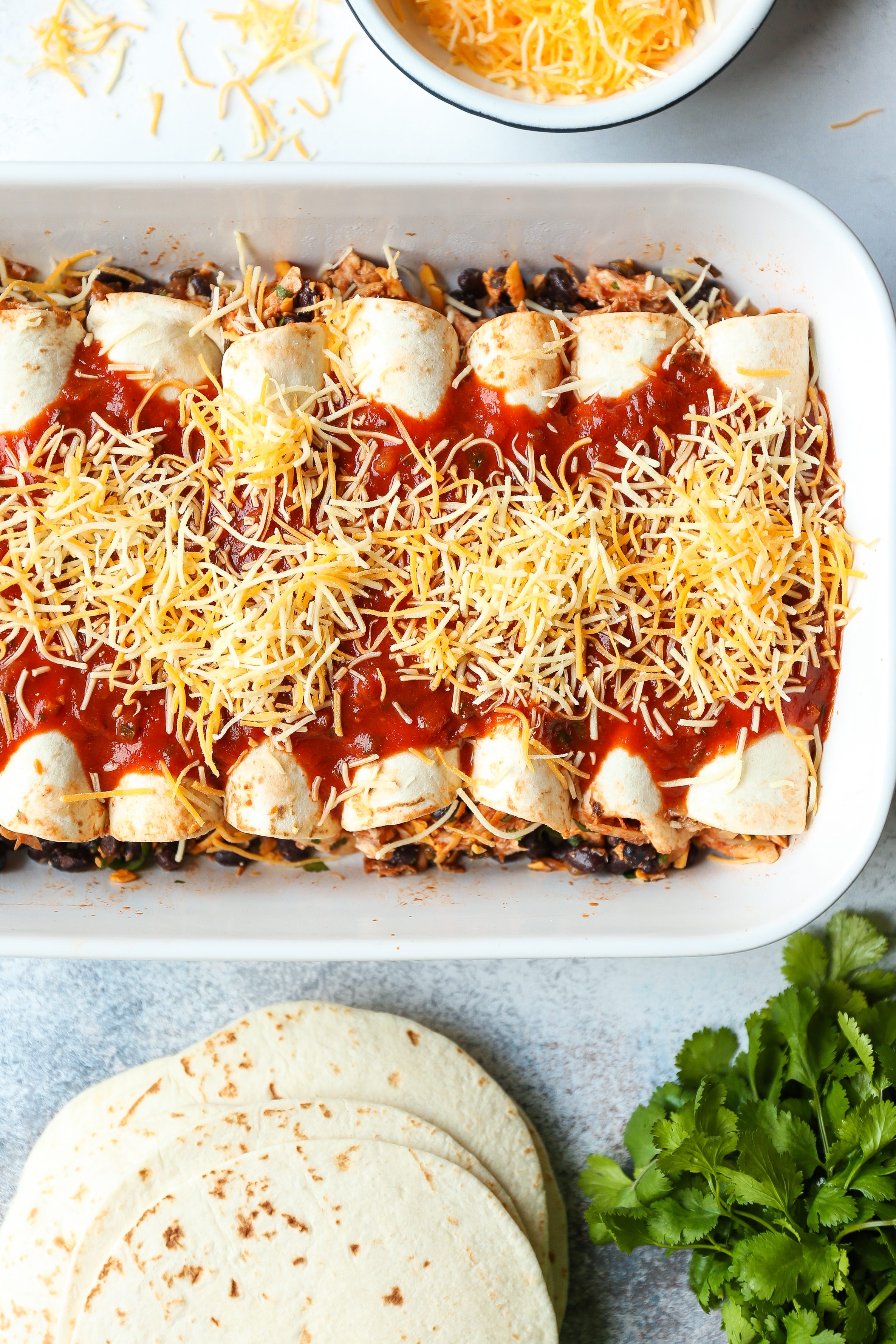 Weeknight Chicken Enchiladas - Classic chicken and black bean enchiladas! Easy to assemble with quick homemade enchilada sauce! Yes, please!