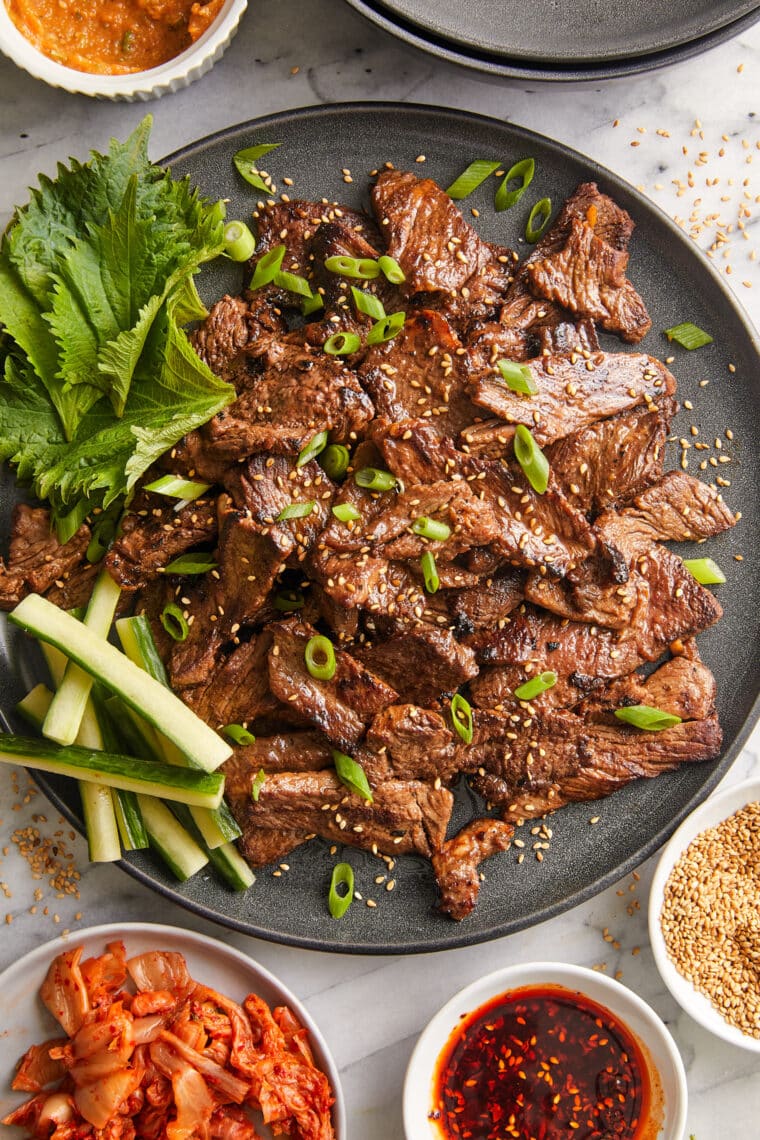 Korean Beef Bulgogi - A super easy recipe for Korean BBQ with the most flavorful marinade! The thin, tender slices of meat cook SO quickly!