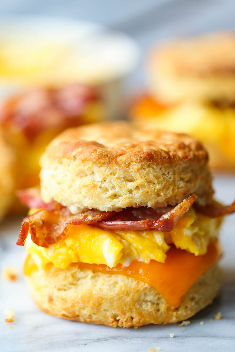 Make Ahead Breakfast Biscuit Sandwiches - Oh-so-warm, flaky buttermilk biscuits with eggs, bacon and cheese. Store in the fridge and reheat in the morning!