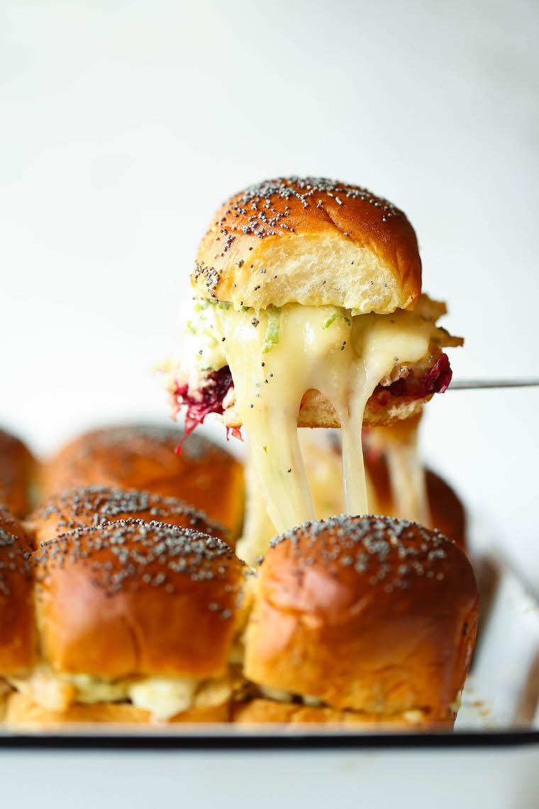 Leftover Thanksgiving Sliders - Leftover turkey, cranberry sauce, Dijon and melted cheese on super buttery Hawaiian rolls. Bake and serve warm! SO SO GOOD.