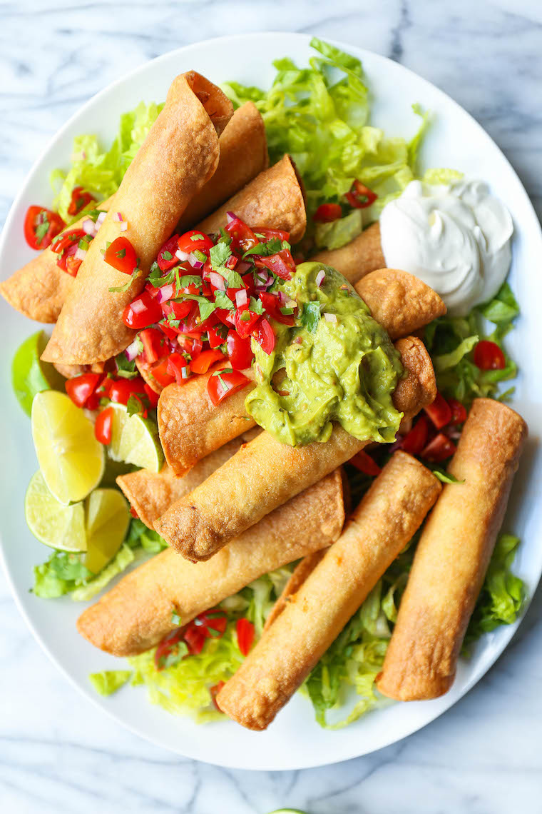 Quick Chicken Taquitos - Such a great way to use up leftover rotisserie chicken! So easy, crispy and crunchy! Serve with guac, pico de gallo and sour cream!