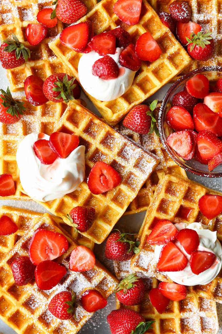 Strawberries and Cream Buttermilk Waffles - The waffles are perfectly fluffy and so light! SO GOOD. Topped with fresh strawberries + homemade whipped cream!