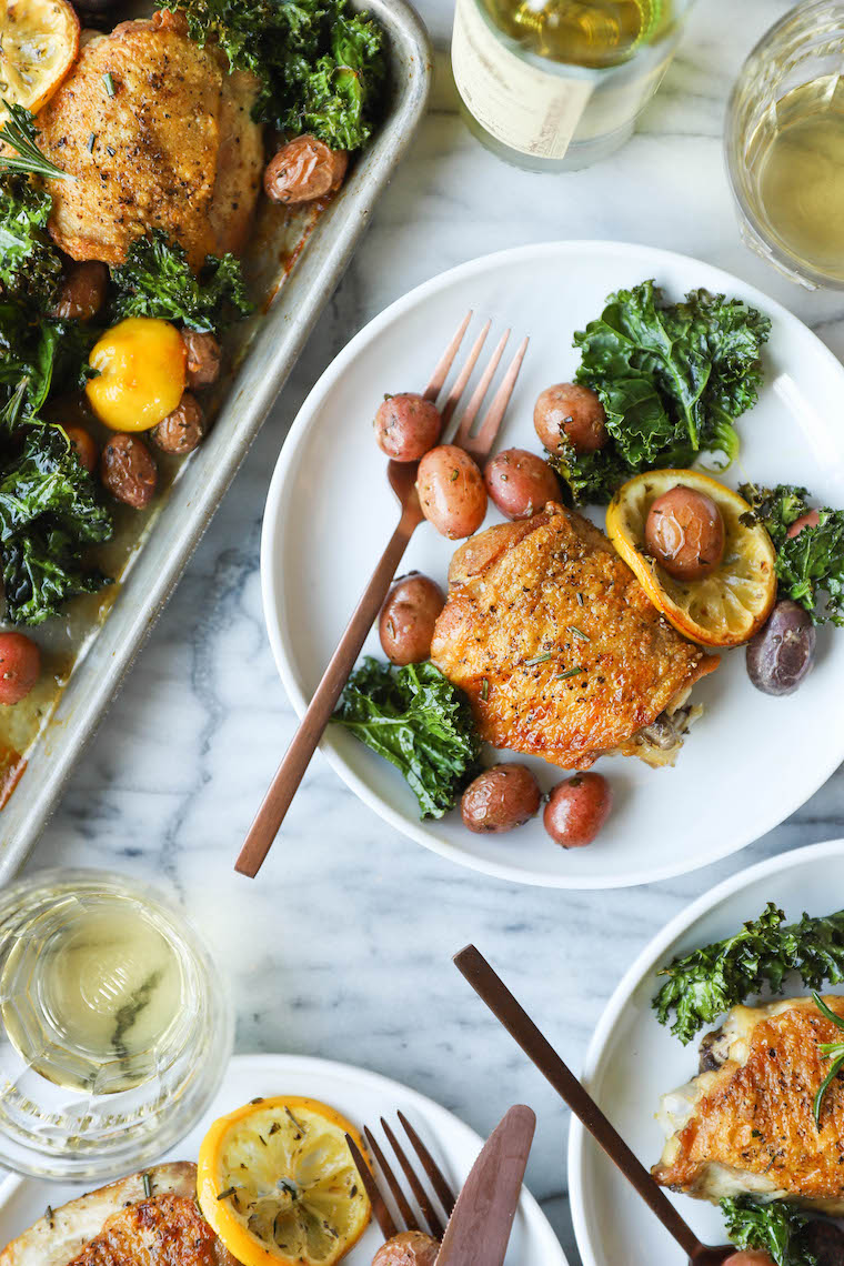 Sheet Pan Lemon Rosemary Chicken - SHEET PAN DINNER! Crispy, juicy chicken thighs with tender baby potatoes and crisped kale. So hearty, so good, so easy!