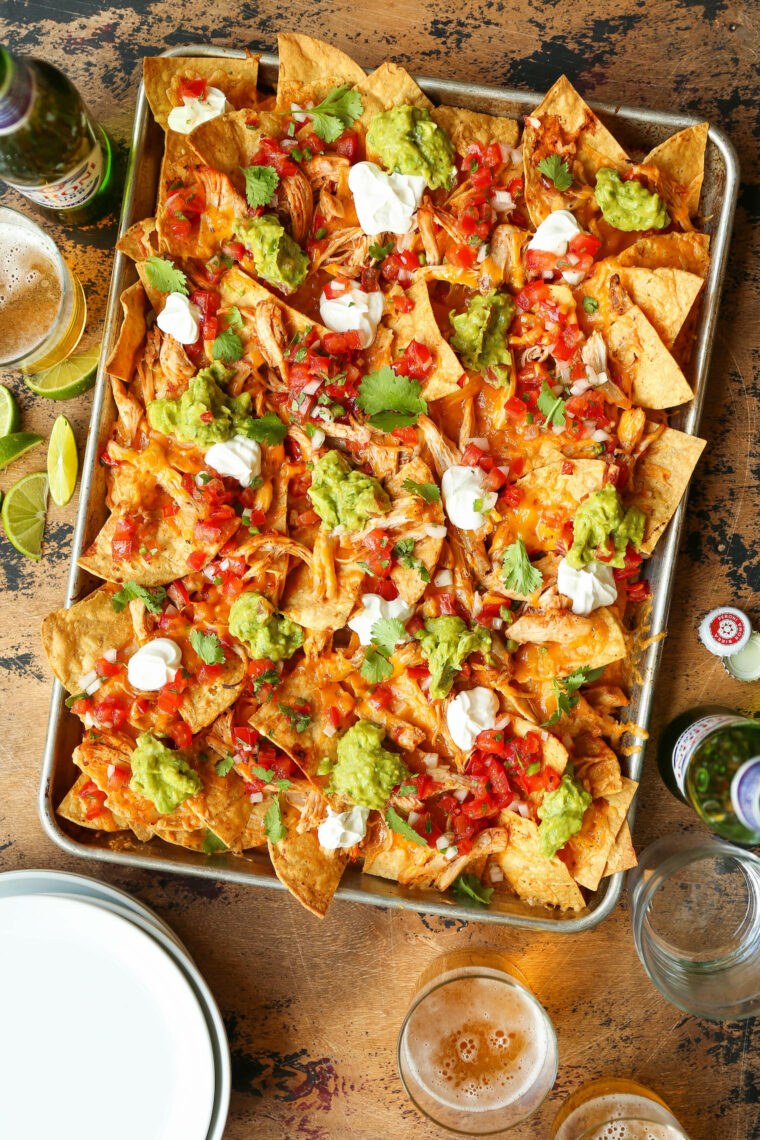 Instant Pot Chicken Nachos - Need to whip up the BEST EVER nachos for a crowd with minimal effort? THIS IS IT! Fully loaded and so so good.
