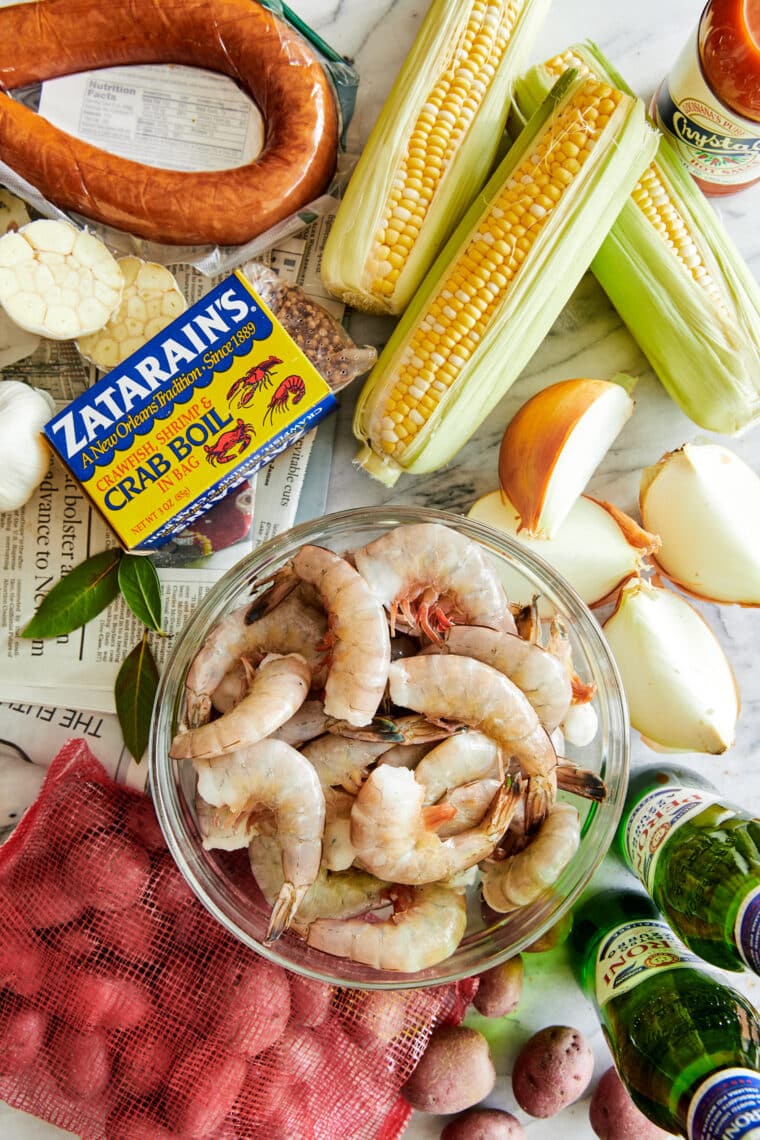 Ingredients: uncooked shrimp, potatoes, corn, garlic, sausage, beer and a packet of Shrimp & Crab Boil seasoning.
