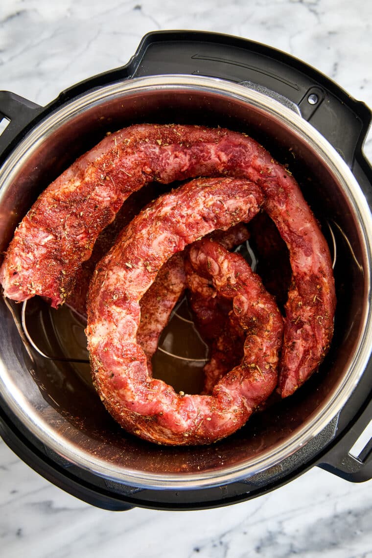 Easy Instant Pot BBQ Ribs - The easiest ribs ever made in less than 1 hr! So saucy, sticky, and tender, it just falls off-the-bone! So good.