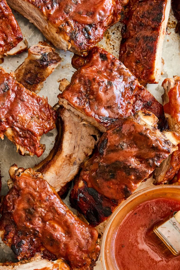 Easy Instant Pot BBQ Ribs - The easiest ribs ever made in less than 1 hr! So saucy, sticky, and tender, it just falls off-the-bone! So good.