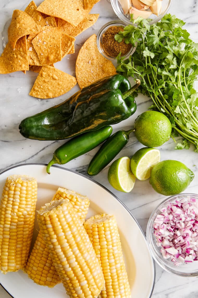 Corn Salsa - Oh so easy, fresh, homemade corn salsa! Made in minutes, perfect with chips or topped on burrito bowls, tacos + quesadillas!!!