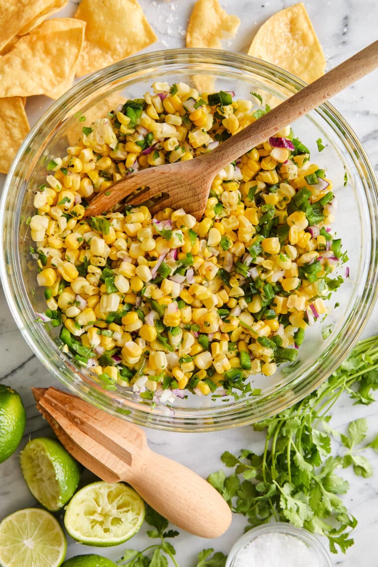 Corn Salsa - Oh so easy, fresh, homemade corn salsa! Made in minutes, perfect with chips or topped on burrito bowls, tacos + quesadillas!!!